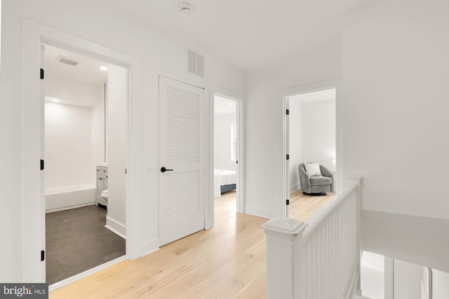 hallway featuring light hardwood / wood-style flooring