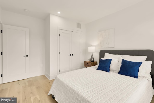 bedroom featuring a closet and light hardwood / wood-style floors