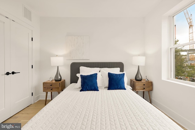 bedroom featuring light wood-type flooring