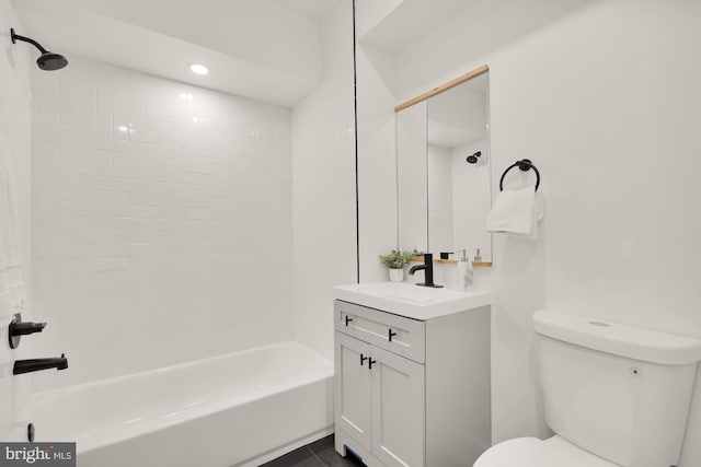 full bathroom featuring shower / bathing tub combination, vanity, and toilet