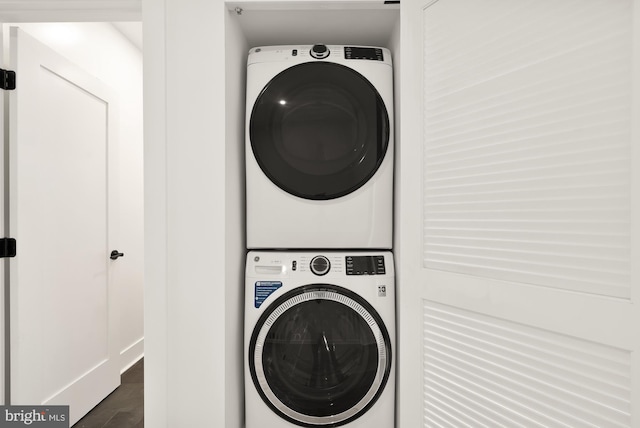 laundry room with stacked washer and clothes dryer