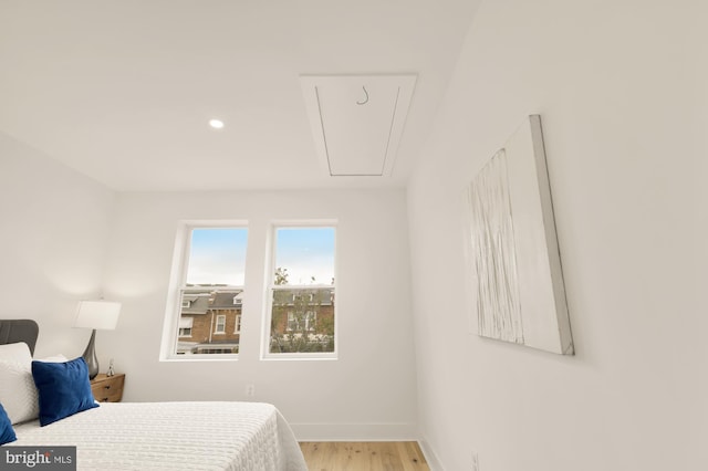 bedroom with light hardwood / wood-style floors