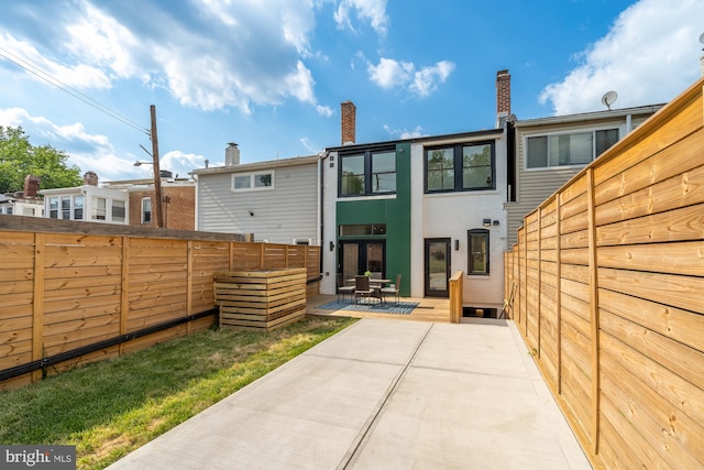 back of house featuring a patio