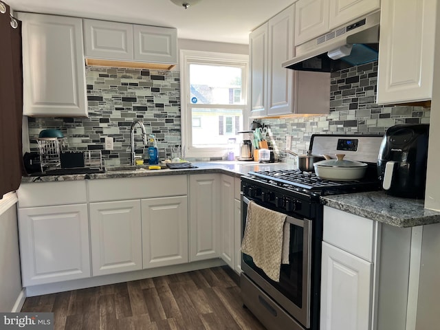 kitchen featuring dark hardwood / wood-style floors, stainless steel gas range oven, white cabinetry, and exhaust hood