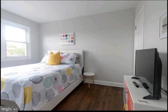 bedroom featuring dark wood-type flooring