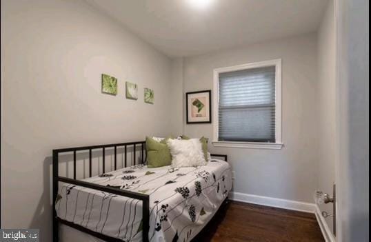 bedroom featuring dark wood-type flooring