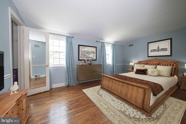 bedroom featuring dark hardwood / wood-style flooring