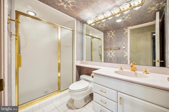 bathroom featuring tile patterned floors, vanity, toilet, and walk in shower