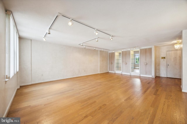 unfurnished room featuring wood-type flooring