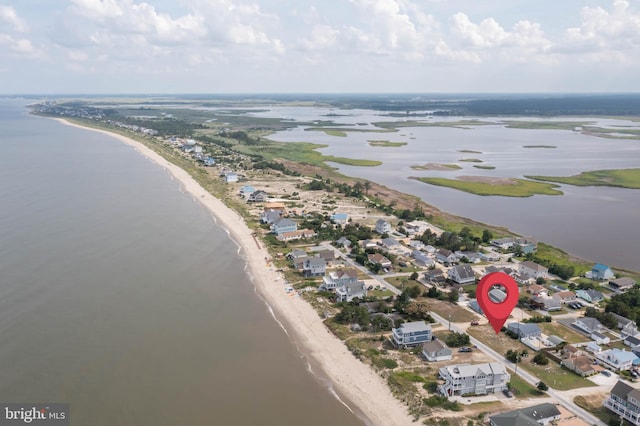 bird's eye view featuring a water view and a view of the beach