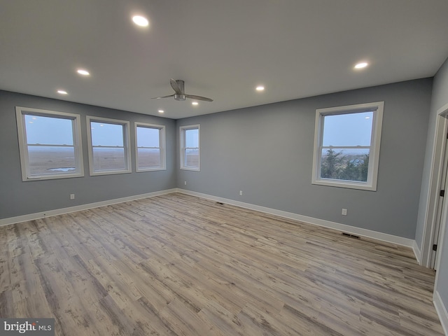 interior space with ceiling fan, a healthy amount of sunlight, and light hardwood / wood-style floors