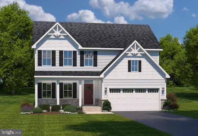 view of front of property featuring a garage and a front lawn