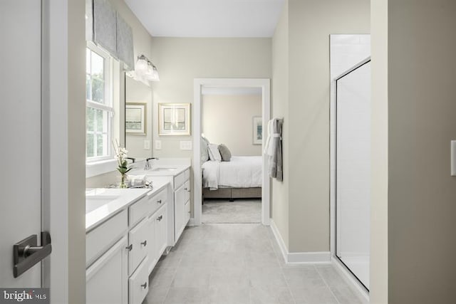 bathroom with vanity and a shower with shower door