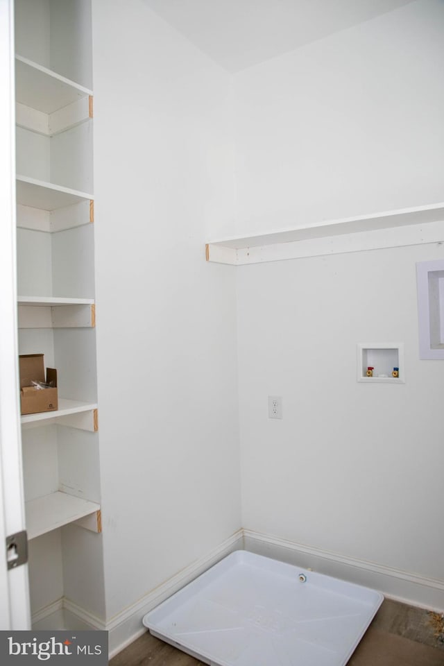 laundry room with wood-type flooring and hookup for a washing machine