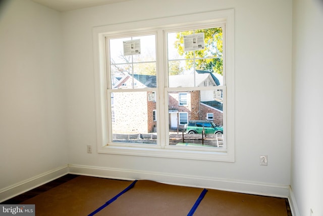 interior space with baseboards and wood finished floors