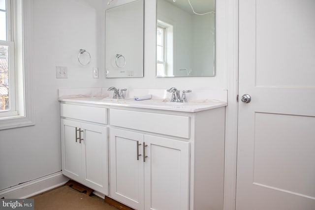 bathroom with double vanity and a sink