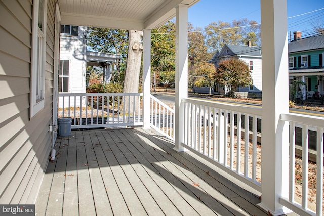 wooden terrace with a porch