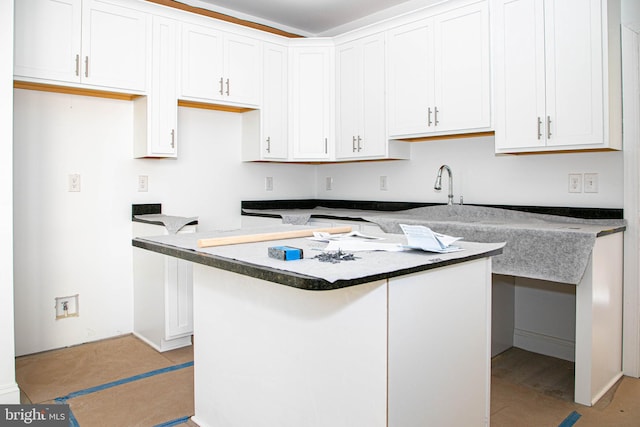 kitchen with sink and white cabinetry