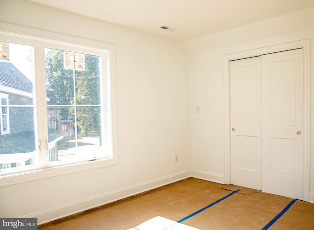 unfurnished bedroom featuring a closet