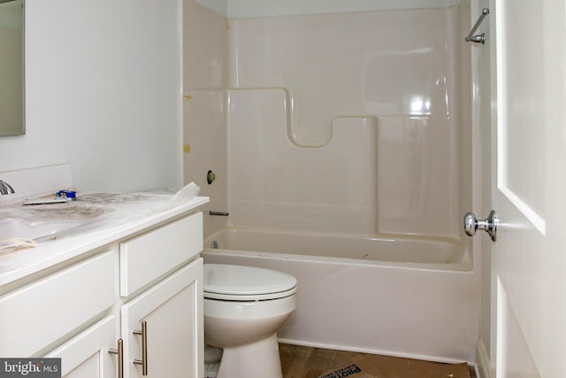 full bathroom with washtub / shower combination, hardwood / wood-style flooring, toilet, and vanity