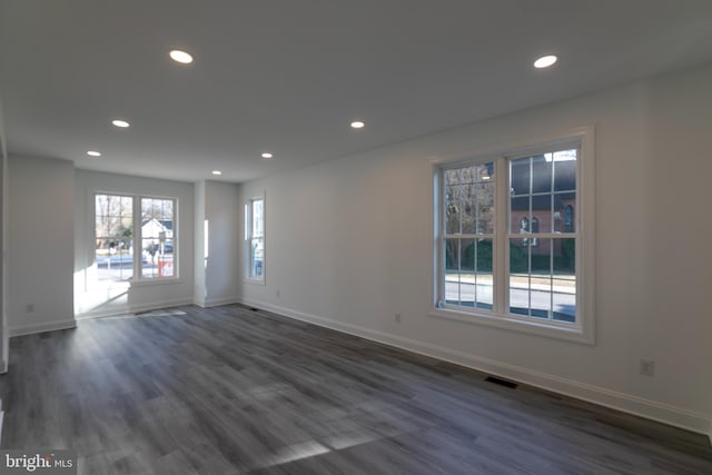 empty room featuring dark wood-type flooring