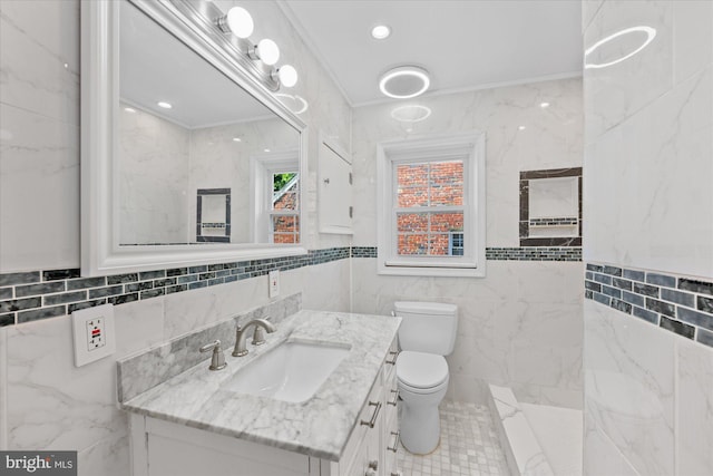 bathroom featuring toilet, vanity, tile walls, and ornamental molding