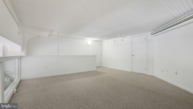 basement with light colored carpet