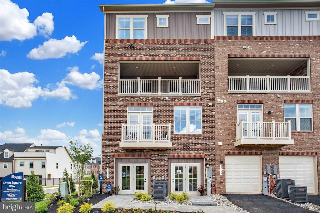 2526A Verona Pl, Ellicott City, MD 21042 - view of front of home featuring cooling unit, a garage, and french doors