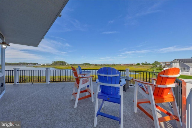 view of patio featuring a water view