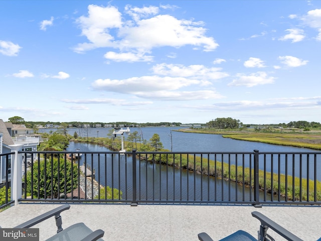 exterior space featuring a water view and a balcony