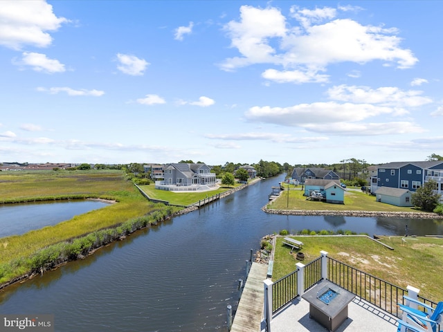 property view of water with an outdoor fire pit