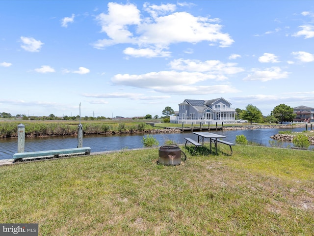 property view of water featuring an outdoor fire pit