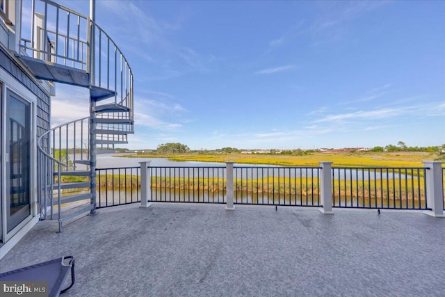 view of patio featuring a water view