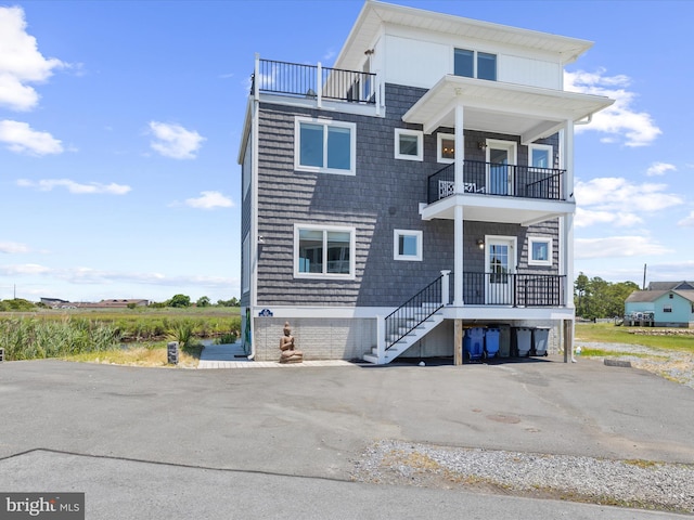 coastal home featuring a balcony