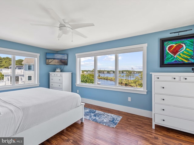 bedroom featuring ceiling fan, french doors, and dark hardwood / wood-style floors