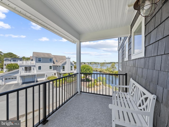 balcony featuring a water view