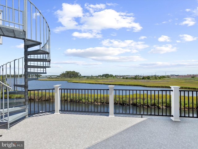 view of patio with a water view