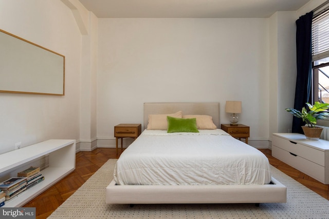 bedroom featuring parquet floors