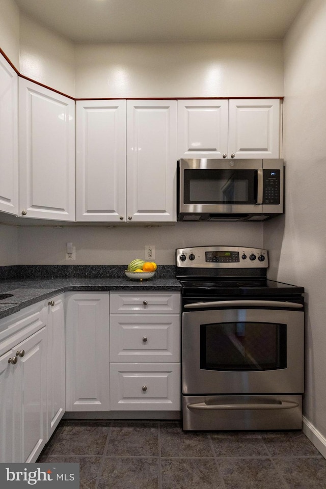 kitchen with white cabinetry and stainless steel appliances