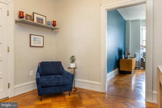 sitting room with parquet flooring