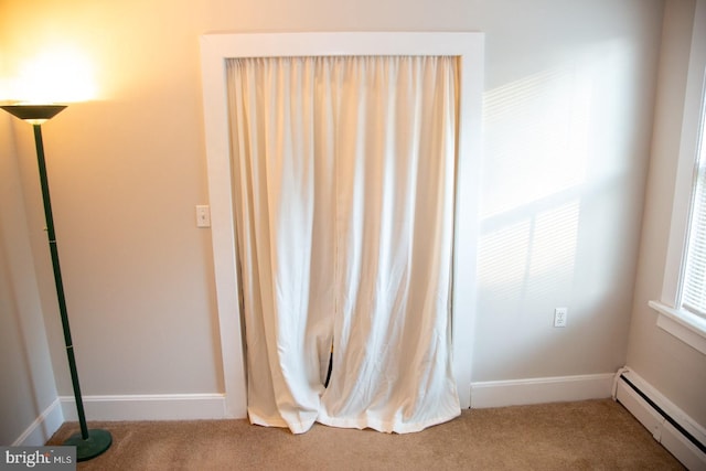 interior space featuring carpet and baseboard heating