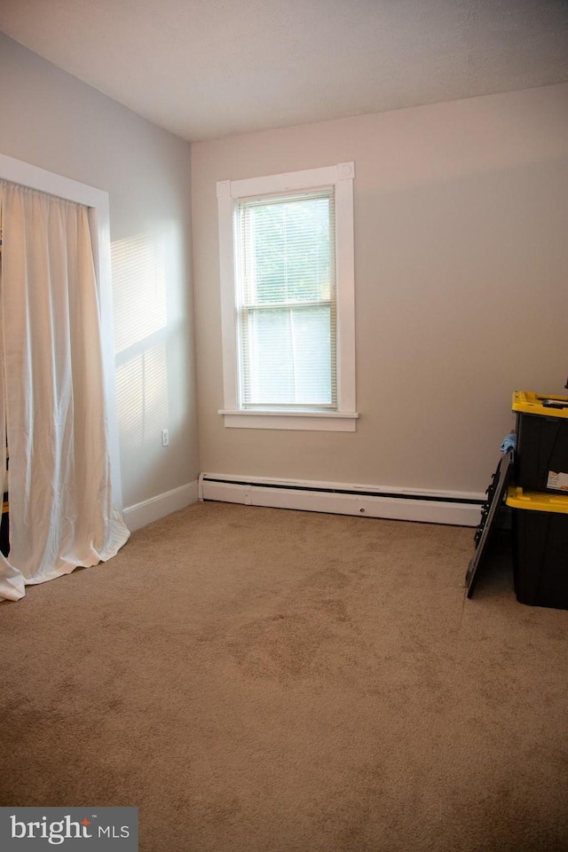 interior space with a baseboard radiator