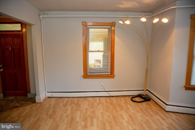 spare room with light wood-type flooring