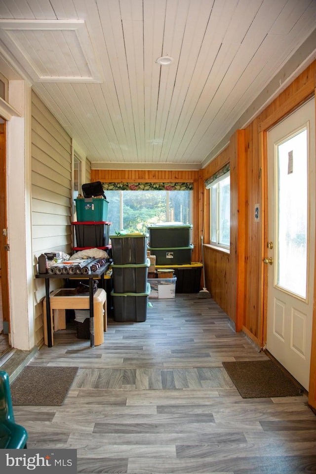 unfurnished sunroom with plenty of natural light and wood ceiling