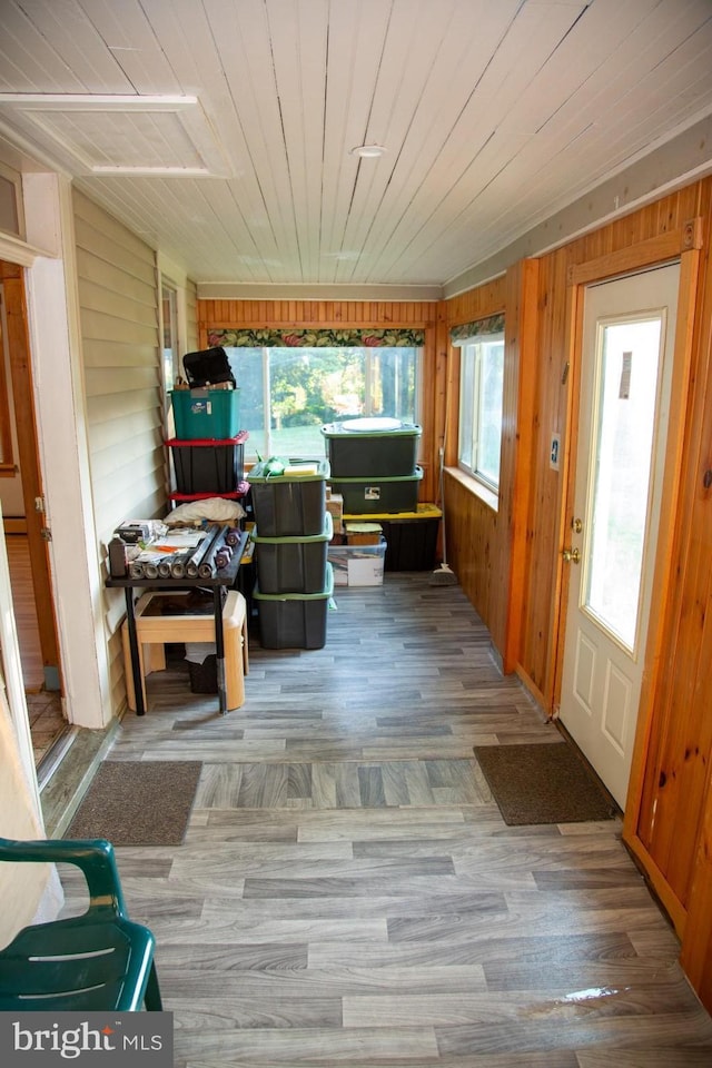 unfurnished sunroom with wooden ceiling