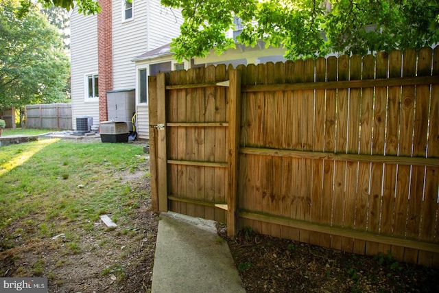 view of gate featuring central air condition unit