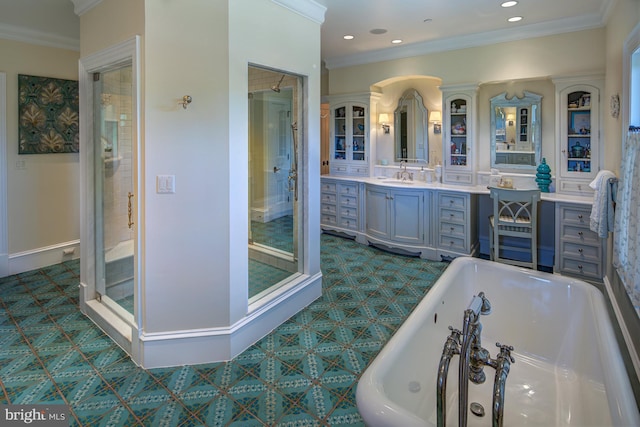 bathroom featuring vanity, ornamental molding, and shower with separate bathtub