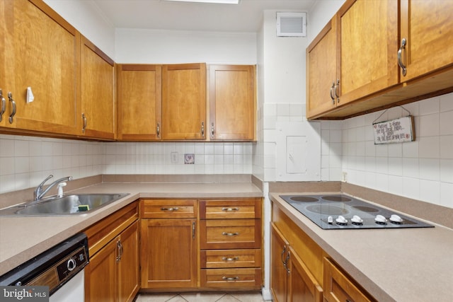 kitchen featuring backsplash, black electric cooktop, sink, and stainless steel dishwasher