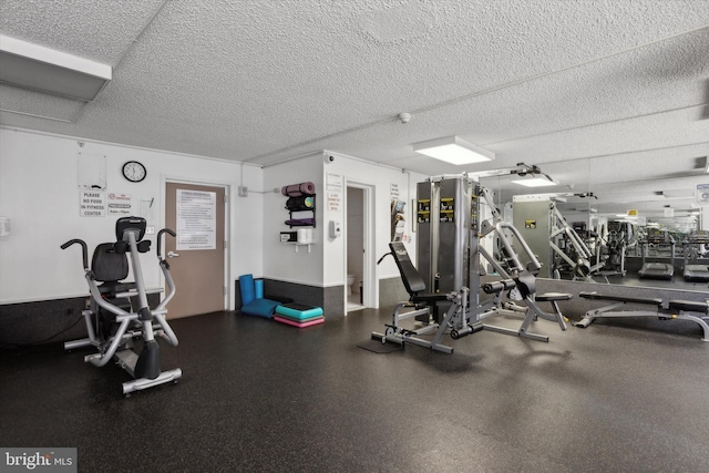 workout area with a textured ceiling