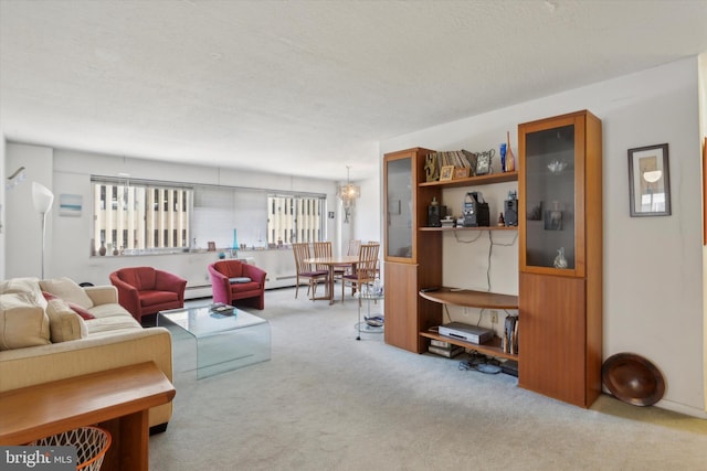 living room featuring light colored carpet, a textured ceiling, and a baseboard heating unit